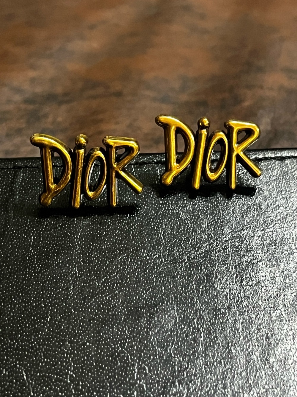Dior. Brushed Gold Spell Out Stud Earrings